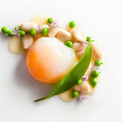 Poached Aracuana Egg with Vin Jaune, Garden Peas and Everglades Frog Legs prepared by Daniel Humm, Executive Chef of Eleven Madison Park in NYC.